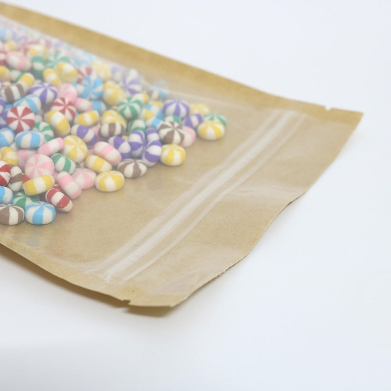 High Quality 100pcs Tear Notch Clear Front Plastic Kraft Stand Up Zip Lock Pouches Brown Kraft Paper Bags With Window